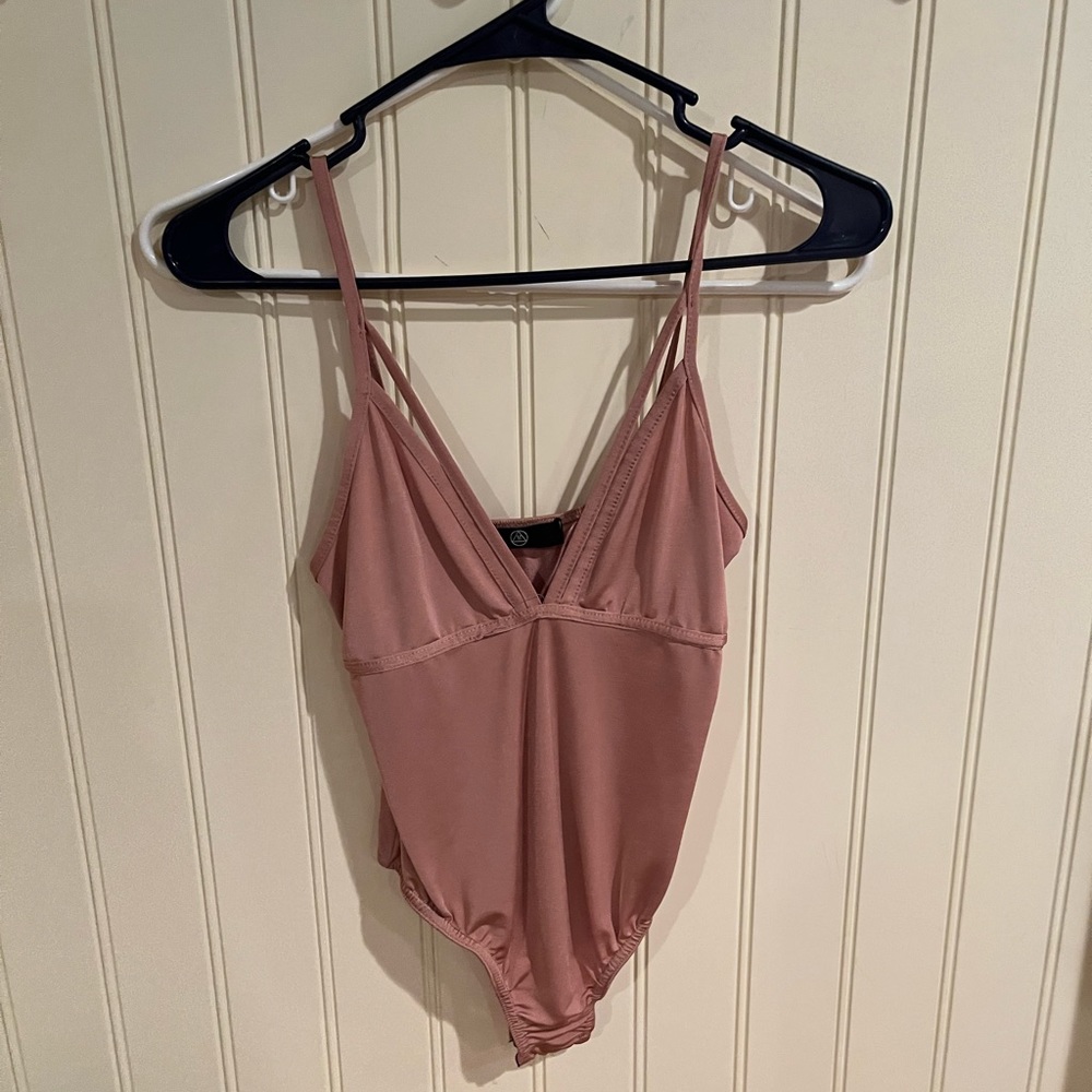 Pinkish onsie from Misguided. Never worn - size 4